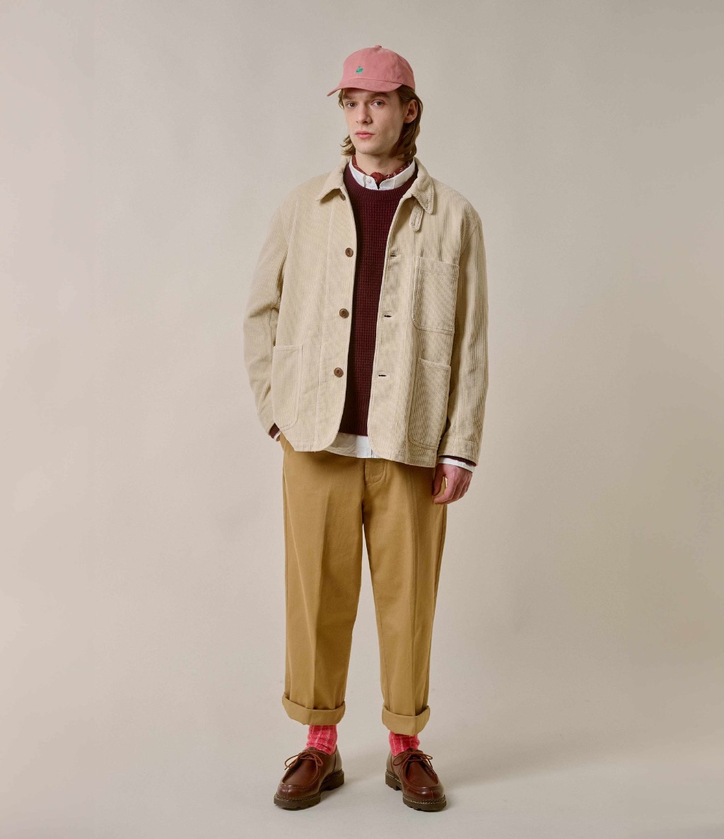 Man wearing ecru corduroy jacket and khaki twill chinos