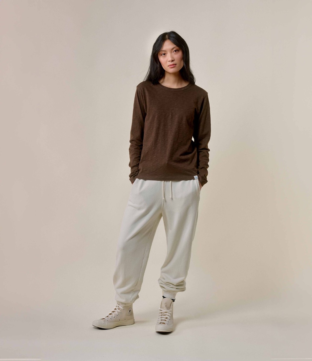 Woman wearing brown Pima longsleeve and ecru sweatpants