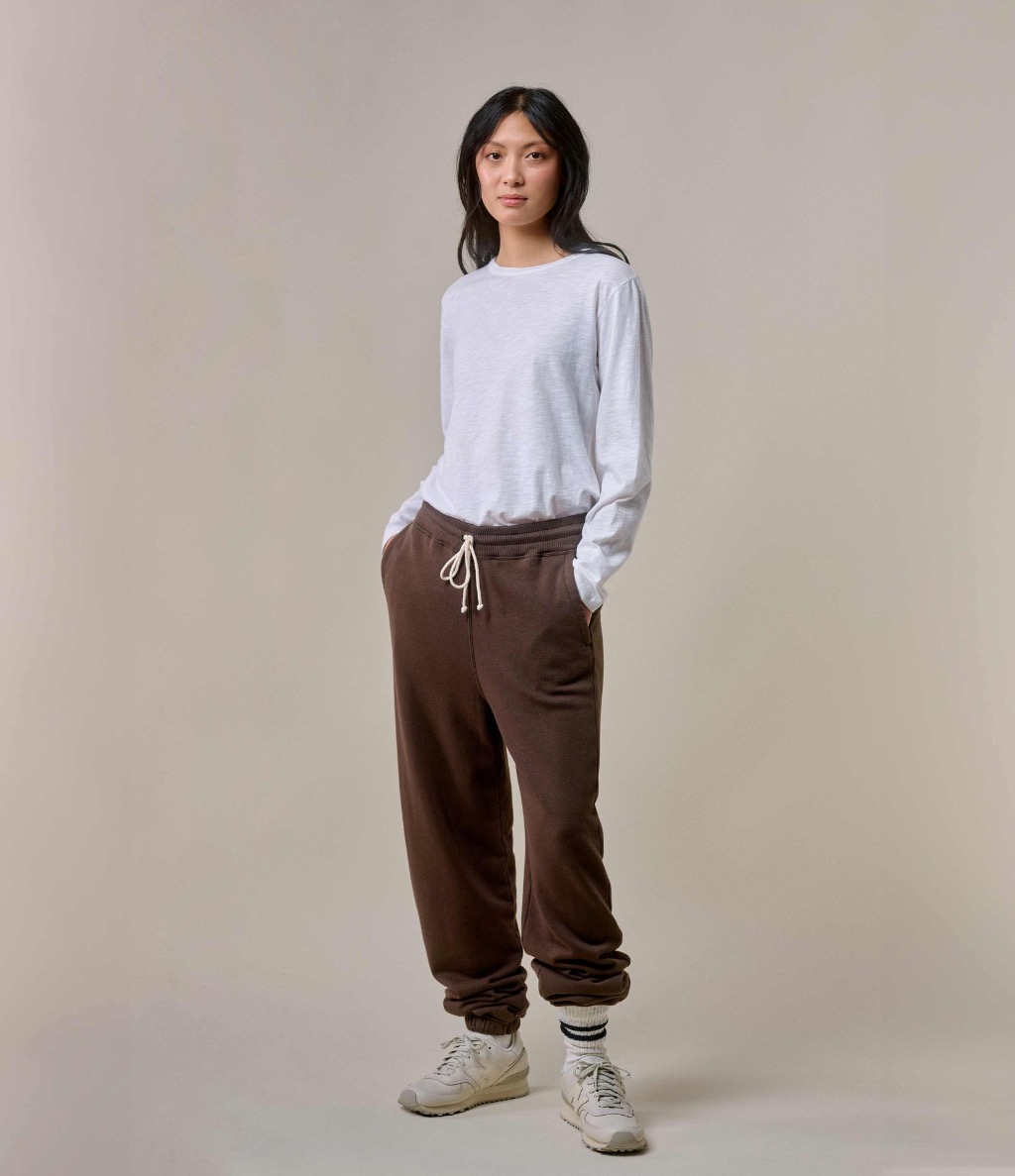 Woman wearing white Pima longsleeve and brown sweatpants