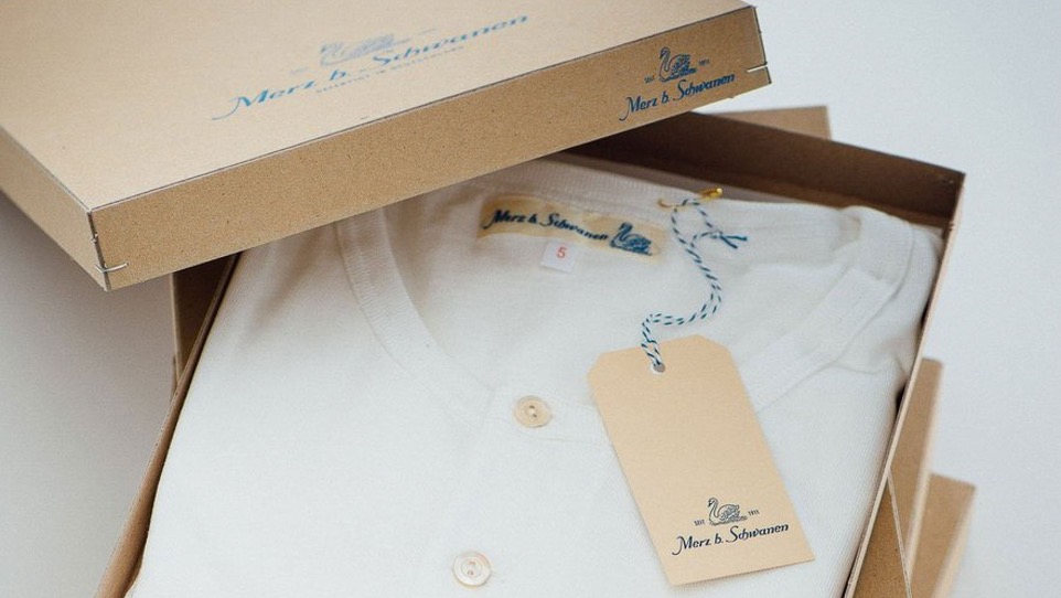 white henley in a cardboard box